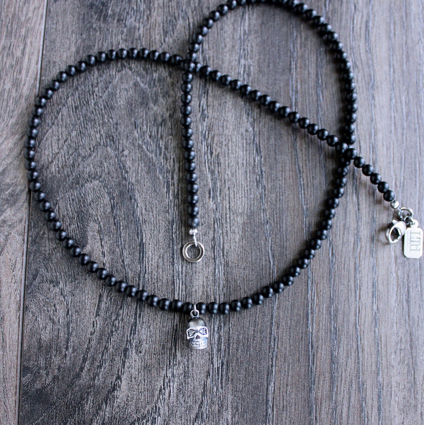 black onyx bead necklace with small skull pendant
