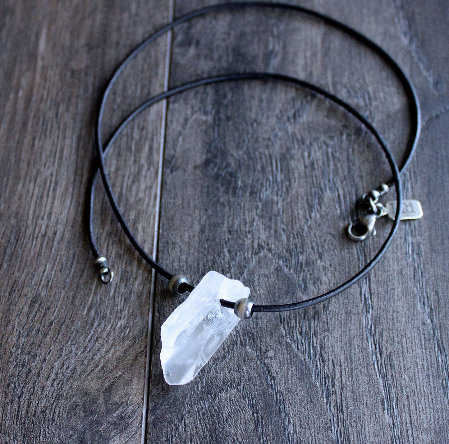 crystal quartz point on leather cord