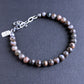 An adjustable bracelet made of Blue Riolita gemstone beads with sterling silver clasp and extension chain.