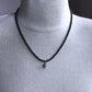 men's small silver skull pendant on beaded necklace