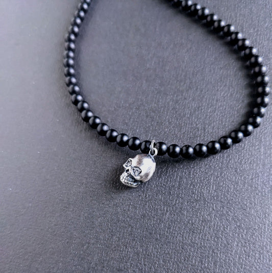 matte onyx bead necklace with silver skull 