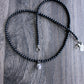 black onyx bead necklace with small skull pendant