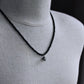 matte black bead necklace with small skull pendant