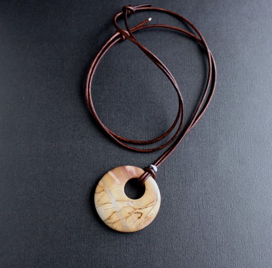 large round stone pendant on leather cord