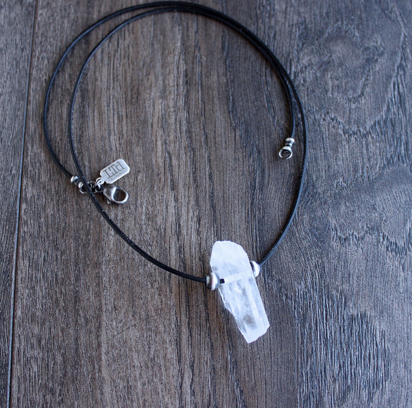 men's crystal quartz pendant on leather cord