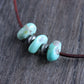 Large turquoise stone leather cord necklace