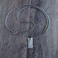 Silver chain necklace with a rustic silver rectangular pendant 