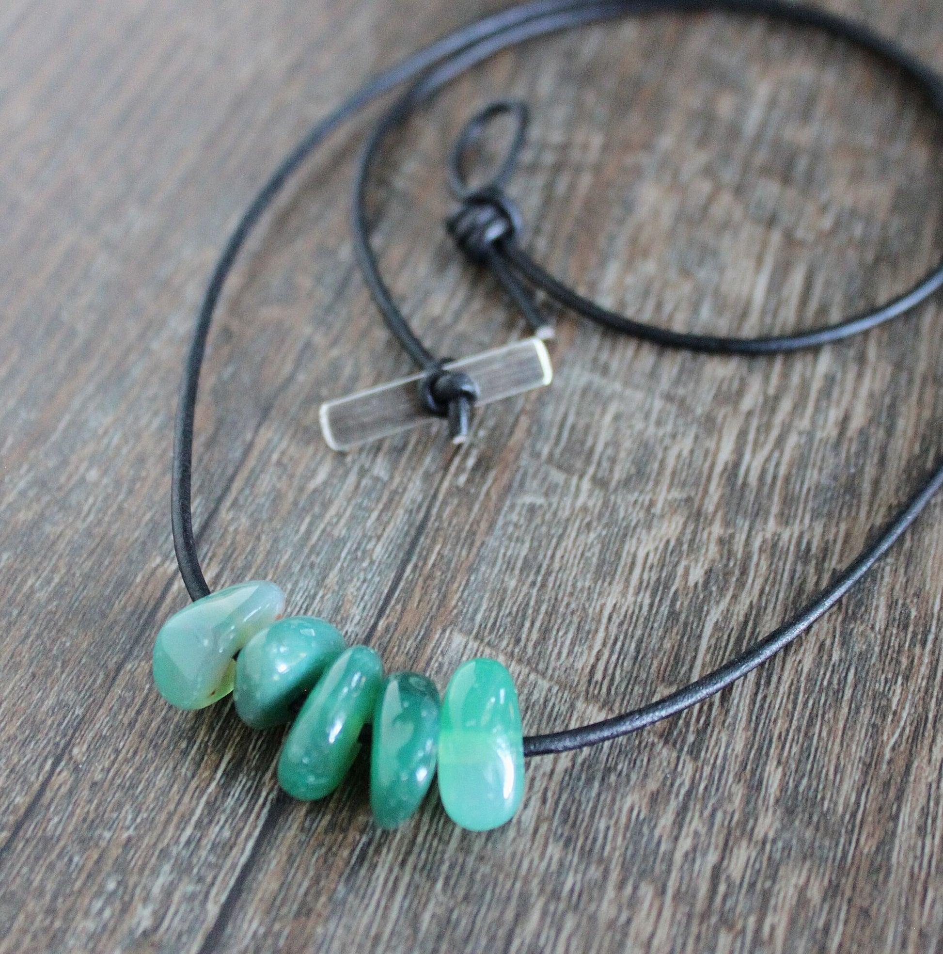 green aventurine beads on leather cord