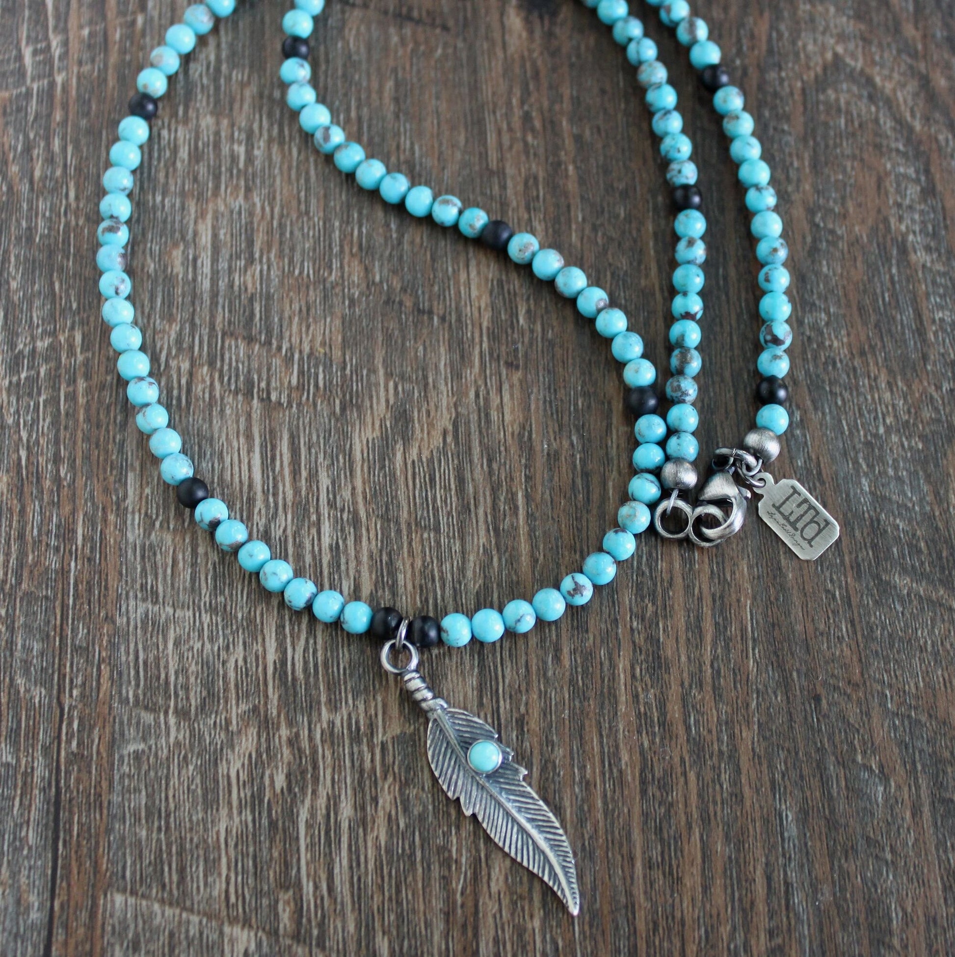 men's feather and turquoise necklace