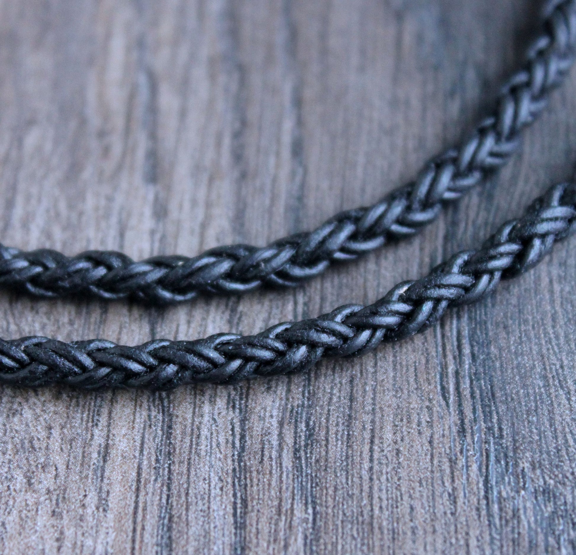 https://lynntodddesigns.com/cdn/shop/products/leather.necklace.round.braid.black4.jpg?v=1675029388&width=1946