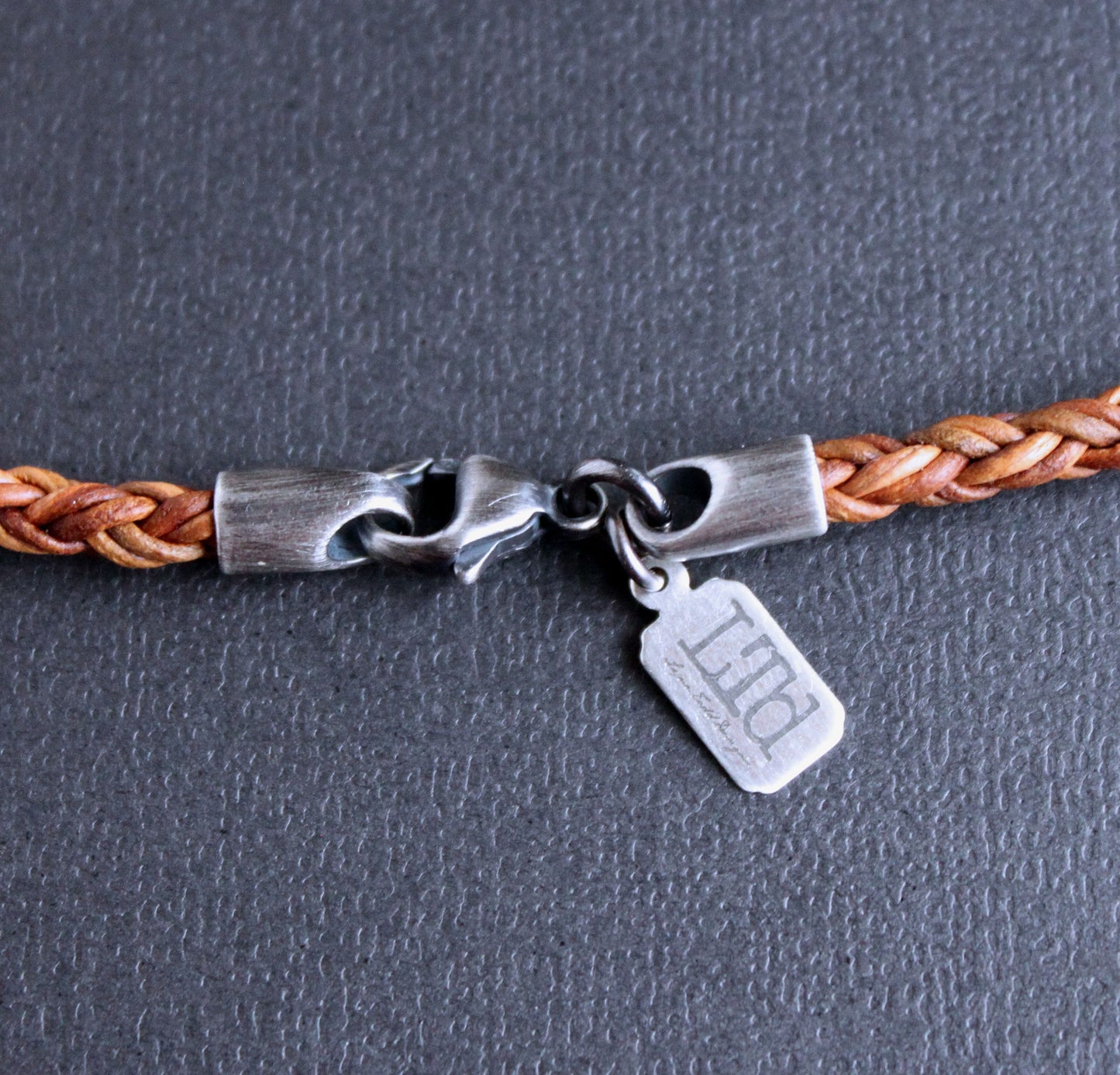 Brown Braided Leather Necklace with Reel Pendant