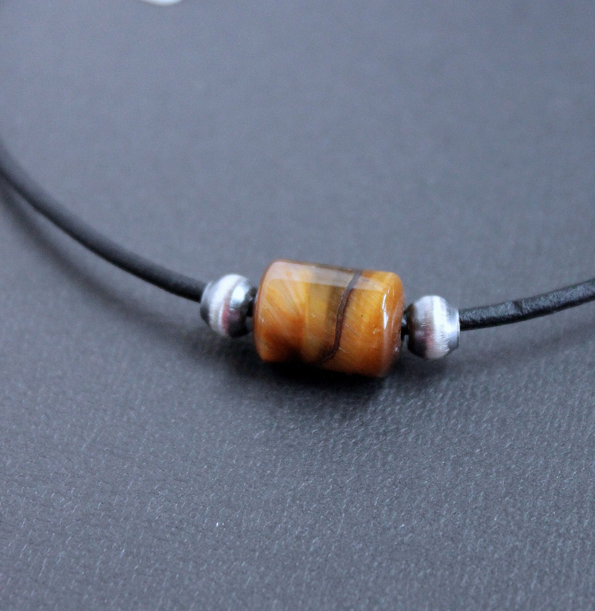 large Tiger's Eye bead on leather cord